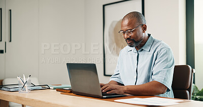 Buy stock photo Laptop, typing and black man in home office with remote work, admin and research for tax preparation. Freelancer, mature person and computer in house with glasses, finance and revenue service website