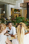 Man, smile and friends in cafe with coffee, social gathering and bonding together on weekend break. Happy, person and group hangout in restaurant with beverage, hospitality and listening to gossip.