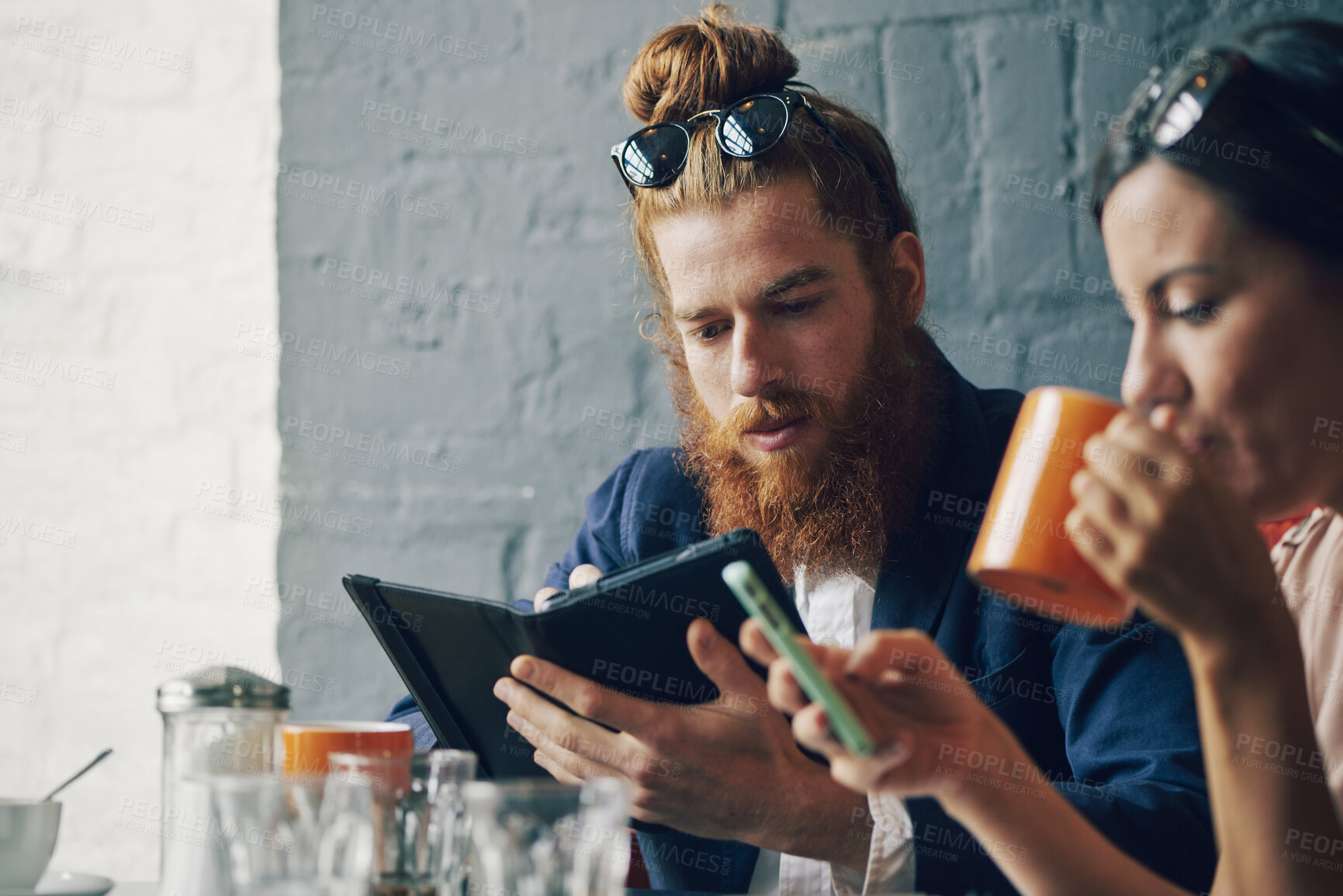 Buy stock photo Coffee shop, tablet and man relax with couple, check news or browsing website for blog in morning. Cafe, tech and customer reading email, review or article with partner for internet notification