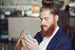 Coffee shop, phone and man relax with app, check news or browsing website for blog in morning. Cafe, tech and customer reading email, online review or article for internet notification