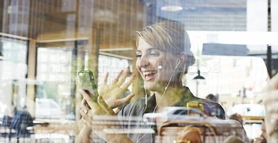 Buy stock photo Earphones, phone and video call with happy woman in coffee shop for chatting or conversation. App, virtual communication and wave with excited person in cafe or restaurant for connection or greeting