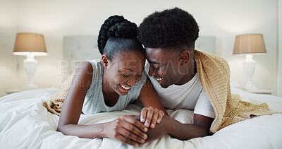 Buy stock photo Smile, love and black couple on bed for conversation, communication and together in home. Relax, comfort and African woman with man in house bedroom for morning, bonding and commitment for marriage