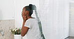 Woman, skincare and mirror in bathroom with morning routine, grooming and preparation for wellness. Space, black person and self care in home with dermatology, cosmetics and getting ready for day.