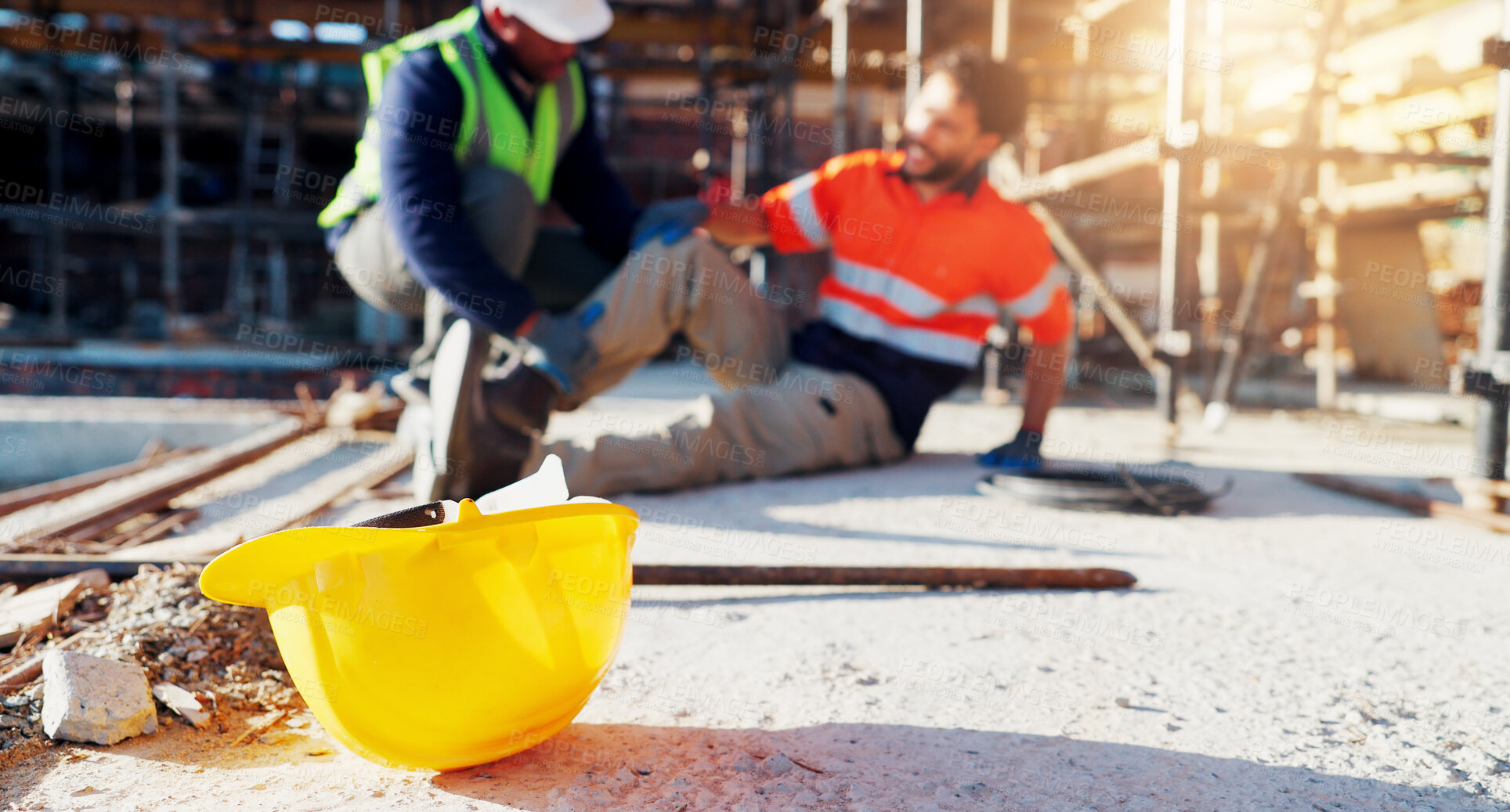 Buy stock photo Hardhat, injury and construction workers on site with accident, fall or leg fracture outdoor. Muscle sprain, men and engineers with helmet for safety compliance with knee pain or medical emergency.