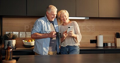 Buy stock photo Love, happy or old couple in kitchen with phone, funny video or post update on social media. Smile, digital or senior people in house with coffee, app scroll or bonding together with humor connection