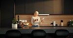 Laugh, coffee or woman in kitchen with phone, funny message or post update on social media. Smile, tech or mature person in home with warm beverage, meme reaction or chat notification on digital app.