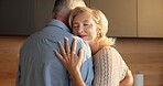 Love, hug and elderly couple in home for support, comfort or bonding together in kitchen. Smile, commitment and old man with woman for connection with marriage, anniversary and embrace in apartment