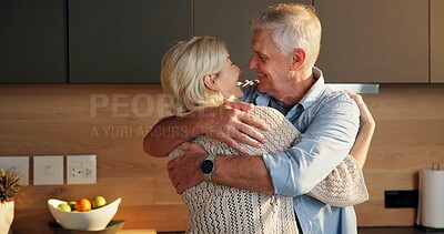 Buy stock photo Smile, hug and senior couple in home for support, comfort or bonding together in kitchen. Love, commitment and elderly people for connection with marriage, anniversary and embrace in apartment