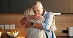 Love, hug and elderly couple in home for support, comfort or bonding together in kitchen. Smile, commitment and senior people for connection with marriage, anniversary and embrace in apartment