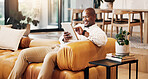 Smile, tablet and reading with black man on couch for social media, online update and communication. Relax, digital tech and happy person in living room of home with ebook, app or subscription