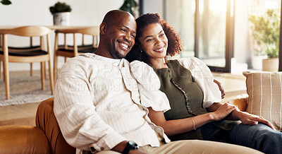 Buy stock photo Couple, relax and watching tv in living room with smile, movie entertainment or love bonding together. Happy, married African people and streaming film in home with weekend break, peace or connection