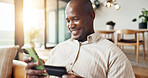 Home, phone and black man with credit card for online shopping, payment or banking app on sofa. Happy, male person or mobile shopper with smile, debit or smartphone for ecommerce or purchase in house