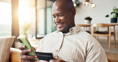 Buy stock photo Home, phone and black man with credit card for online shopping, payment or banking app on sofa. Happy, male person or mobile shopper with smile, debit or smartphone for ecommerce or purchase in house