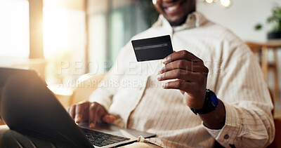 Buy stock photo Man, hands and laptop with credit card in home for ecommerce, payment or online banking service. Male person, computer or debit with smile on sofa for virtual purchase or remote shopping in house