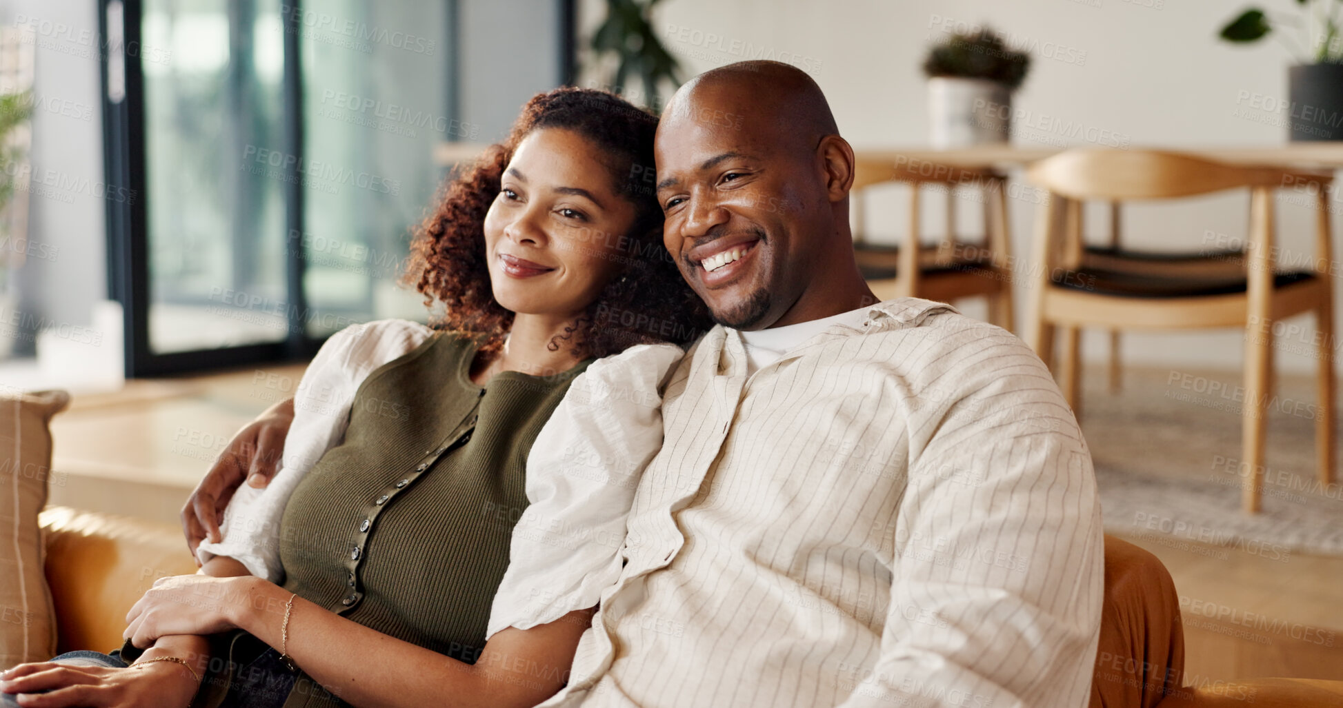 Buy stock photo Happy, couple and relax in living room for watching tv, movie entertainment and love bonding together. Married, African people smile and streaming service in home for film, series and cozy weekend.