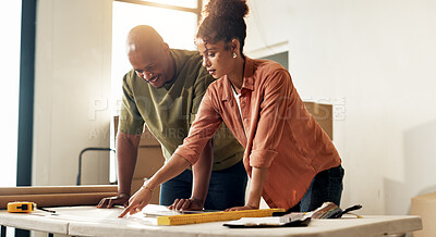 Buy stock photo Couple, planning and renovation in new home with blueprint, property upgrade or interior design. Married, African people and house improvement with layout document, remodeling project or DIY together