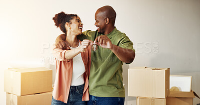 Buy stock photo Happy, couple and moving in new home with key, real estate goals and security for property investment. Married, African people hug and safety in house with keychain, mortgage success and relocation.