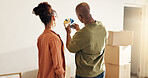 Couple, planning and moving in new home with color swatch, interior design decision or renovation. Back, married people and paint options in house for remodeling project, property upgrade or makeover