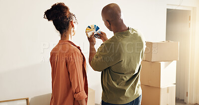 Buy stock photo Couple, planning and moving in new home with color swatch, interior design decision or renovation. Back, married people and paint options in house for remodeling project, property upgrade or makeover