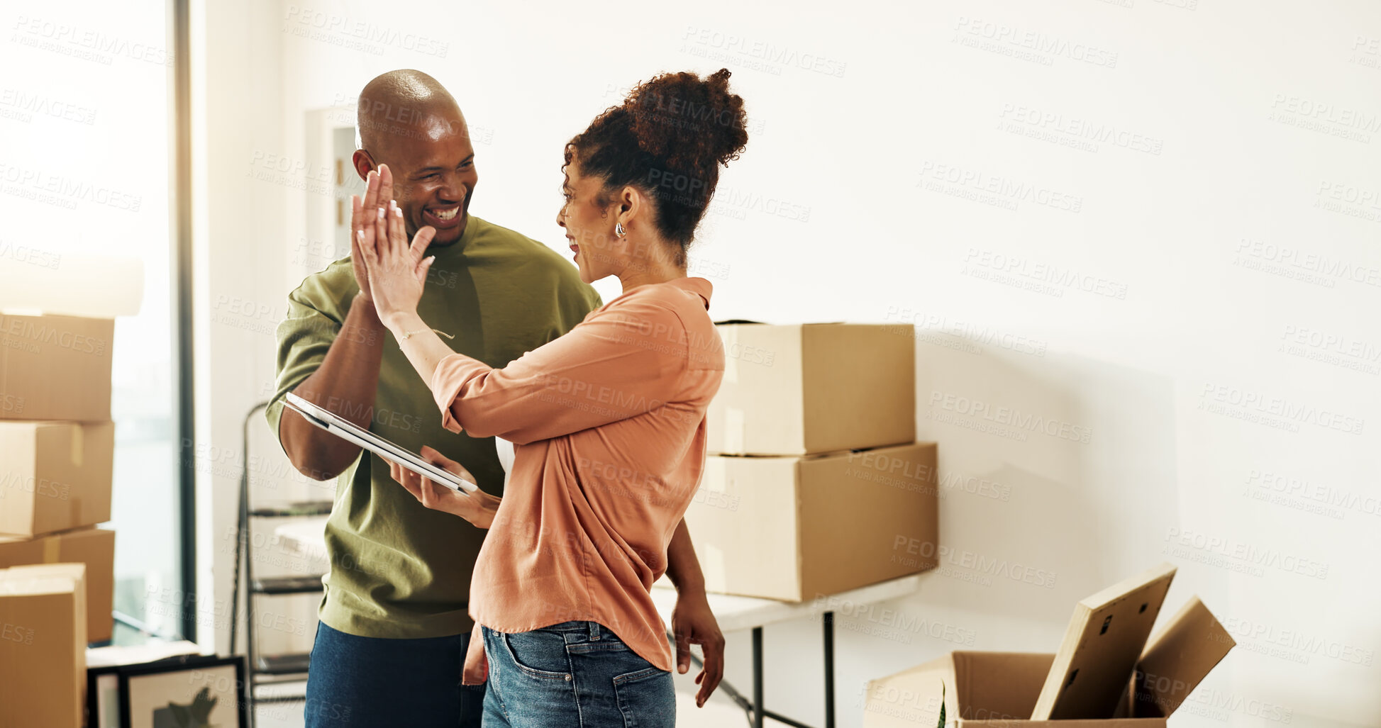 Buy stock photo Happy, couple and high five in new home with tablet, bonding or complete interior design planning. Married, African people and celebration in dream house with tech, renovation success or moving goals