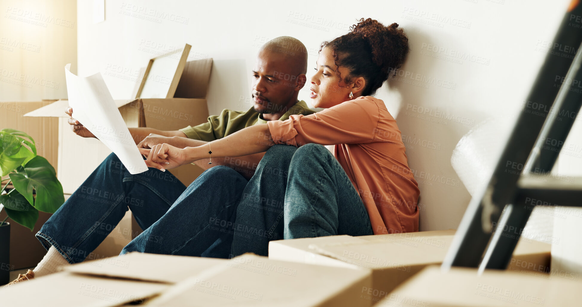 Buy stock photo Boxes, floor plan and tablet with couple in new home together for diy project or renovation. Blueprint, conversation and interior design with homeowner people on ground for development or improvement