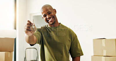 Buy stock photo Moving, portrait and man with key in new house, success and happy with property investment and loan. Black person, smile and confident with milestone, real estate and mortgage opportunity in home