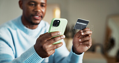Buy stock photo Phone, home and black man with credit card for payment, online banking app or mobile shopping. Male person, shopper or user with debit or smartphone for ecommerce or wireless transaction in house