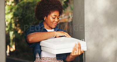 Buy stock photo Box, pizza delivery and black woman at entrance to home for food order or takeaway service. Courier, meal and package with happy customer at front door of apartment for consumerism or purchase