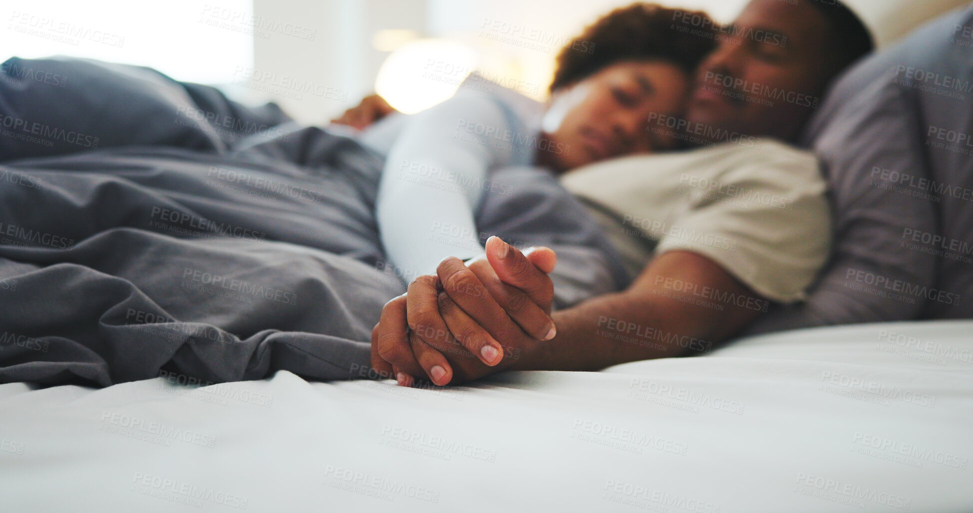 Buy stock photo Holding hands, love and relax with black couple in bed at apartment together for bonding or rest. Affection, morning and sleeping with calm people in bedroom of home for break, holiday or romance