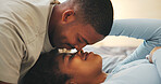 Love, morning and nose touch with black couple in bed at apartment together for bonding or connection. Moment, rest and wake up with happy people in bedroom of home for break, holiday or romance