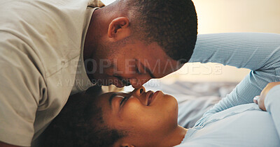 Buy stock photo Love, morning and nose touch with black couple in bed at apartment together for bonding or connection. Moment, rest and wake up with happy people in bedroom of home for break, holiday or romance