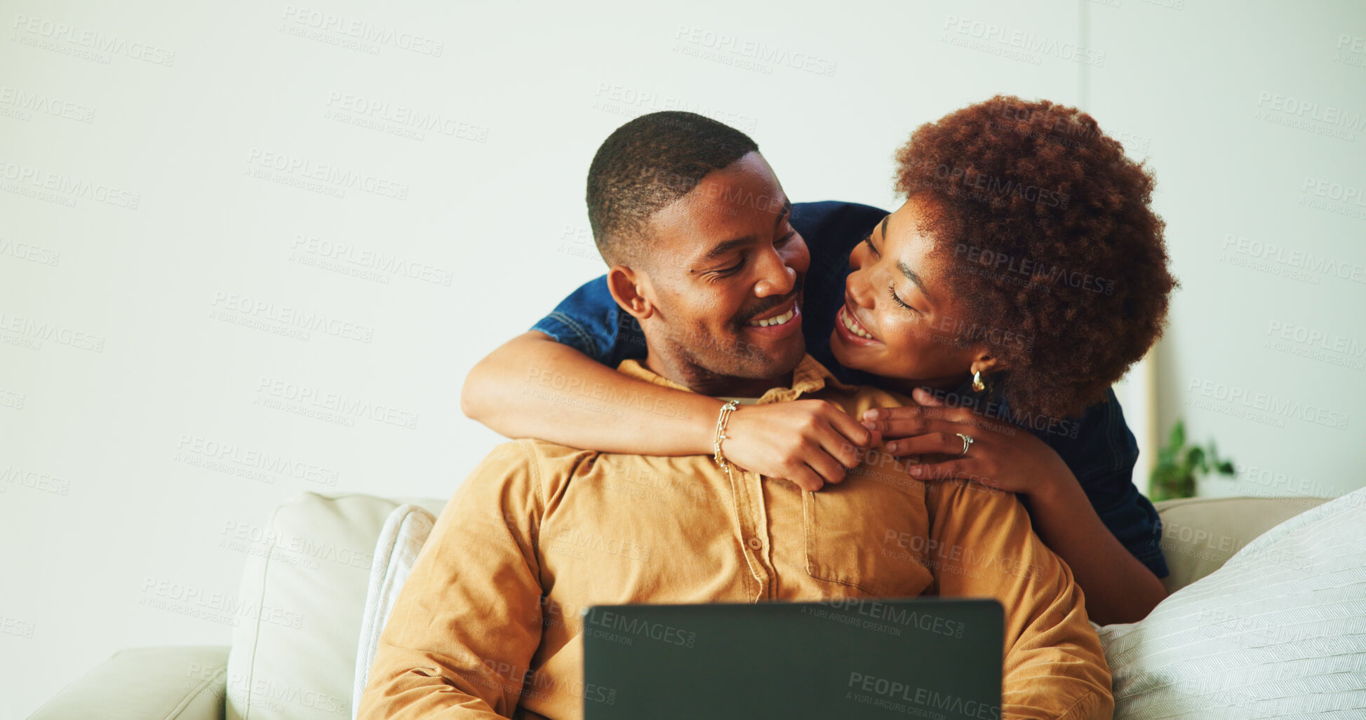 Buy stock photo Smile, hug and couple in home with laptop, research and browsing website with affection. Happy, African people and embrace in lounge with tech, streaming movies and bonding together for weekend break