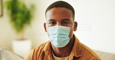 Buy stock photo Face mask, portrait and virus with black man in home living room for prevention of infection. Compliance, protection and safety with person on sofa in apartment for healthcare or medical regulations