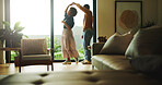 Dancing, happy and couple in home with music for bonding, love and connection in marriage. Smile, living room and man with woman for moving to romantic playlist, radio or album together at house.