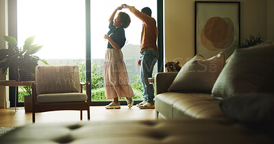 Buy stock photo Dancing, happy and couple in home with music for bonding, love and connection in marriage. Smile, living room and man with woman for moving to romantic playlist, radio or album together at house.