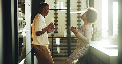 Buy stock photo Couple, laugh and coffee in kitchen with bonding together, relationship and funny joke for connection. Happy, married black people and warm drink in home with humor, care and relax on weekend break.