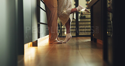 Buy stock photo Couple, legs and romance in home, tiptoe and bonding with partner on weekend, connection and support. People, together and commitment for relationship, feet and affection for spouse or love in house