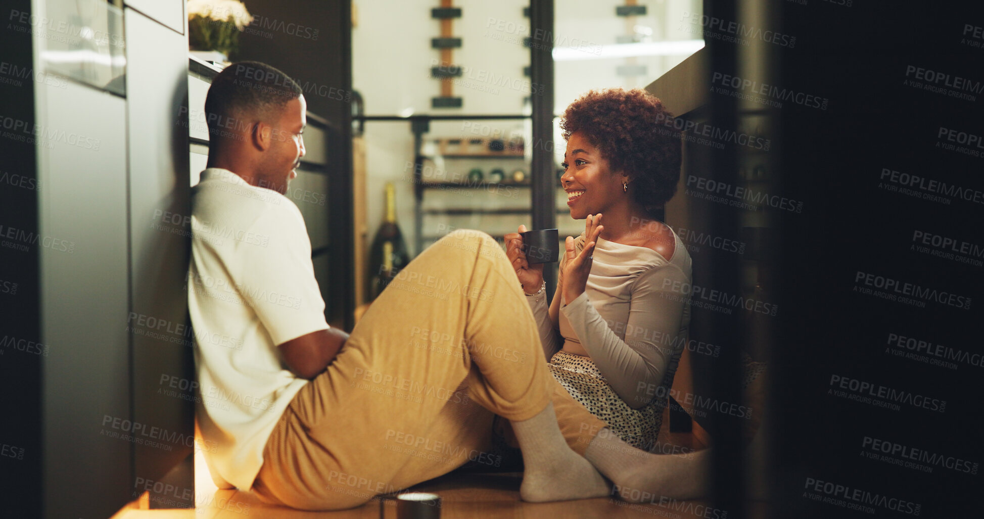 Buy stock photo Morning, coffee and couple in kitchen with conversation, bonding together and smile for connection. Space, married black people and relax in home with warm drink, care or discussion on weekend break.