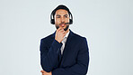 Headset, thinking and businessman in studio for call center, crm or help desk with planning. Space, mic and technical support consultant with customer service, contact or solution by white background