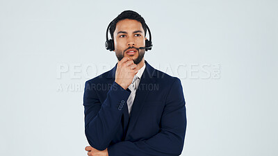 Buy stock photo Headset, thinking and businessman in studio for call center, crm or help desk with planning. Space, mic and technical support consultant with customer service, contact or solution by white background