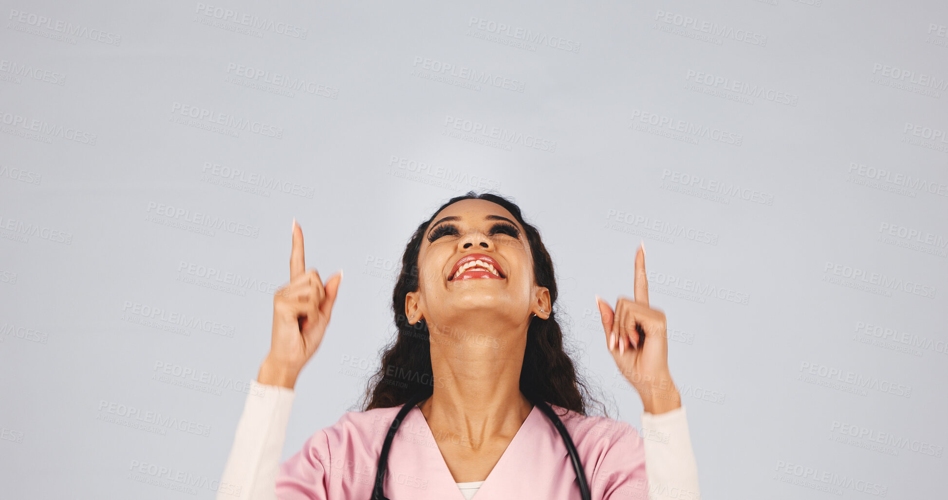 Buy stock photo Doctor, woman and pointing up in studio with smile, female reproductive health idea or cure for disease. Happy, person or medical worker with gesture, gynecology advice and space on white background.