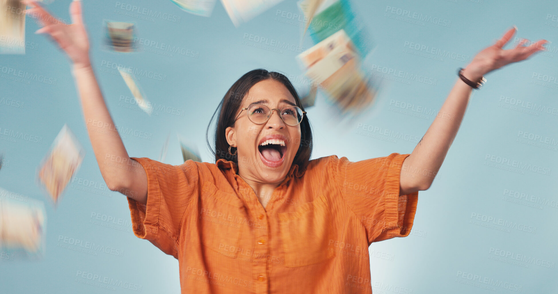 Buy stock photo Excited, celebrate and woman in studio with money rain, lottery success and giveaway prize. Happy, winner and person with cash for winning competition, promotion and income bonus on blue background