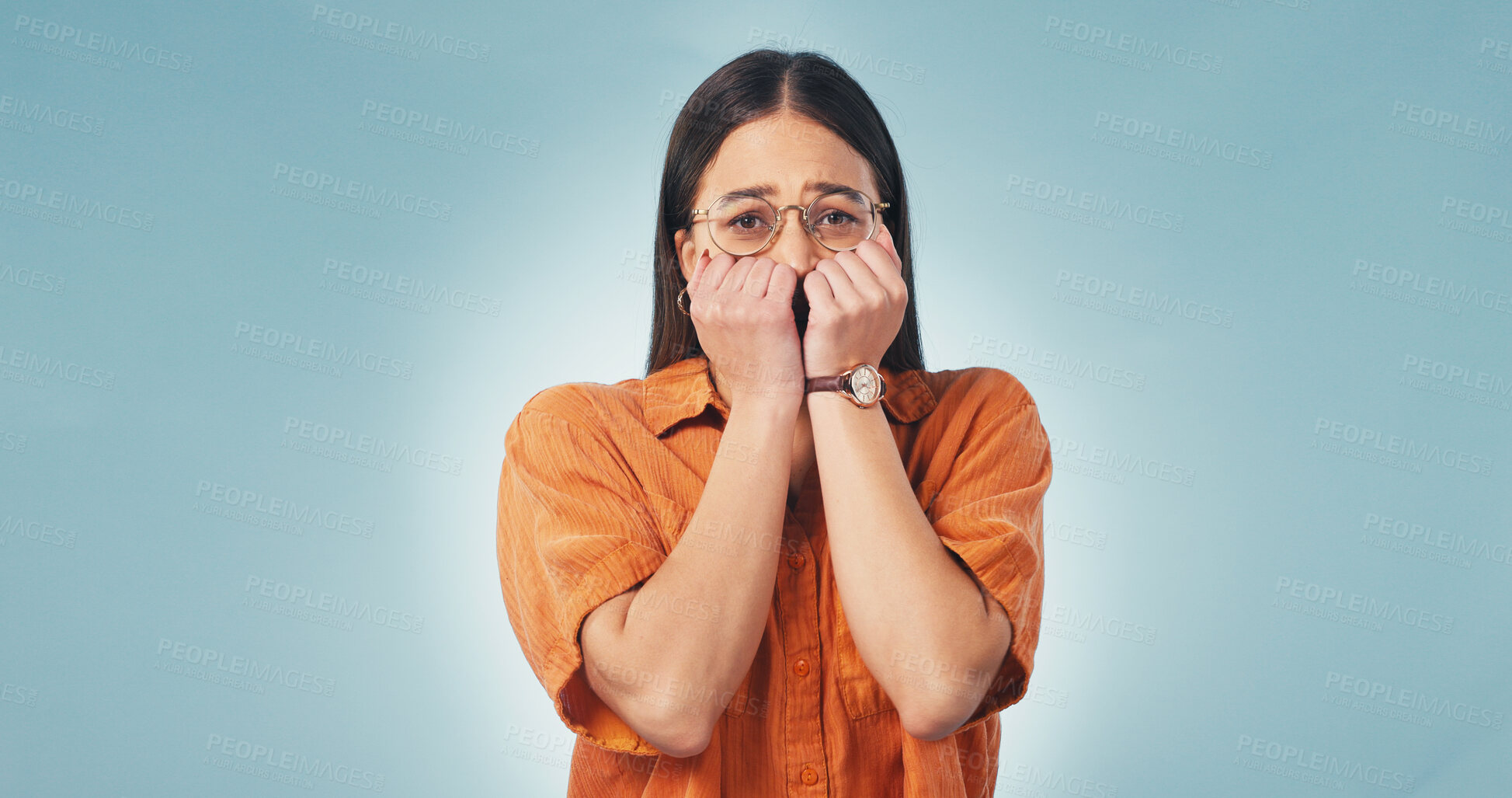 Buy stock photo Woman, portrait and studio with stress for bad news, anticipation or anxiety on a blue background. Nervous, female person or unease with worry, concern or fear for mistake, failure or regret on space