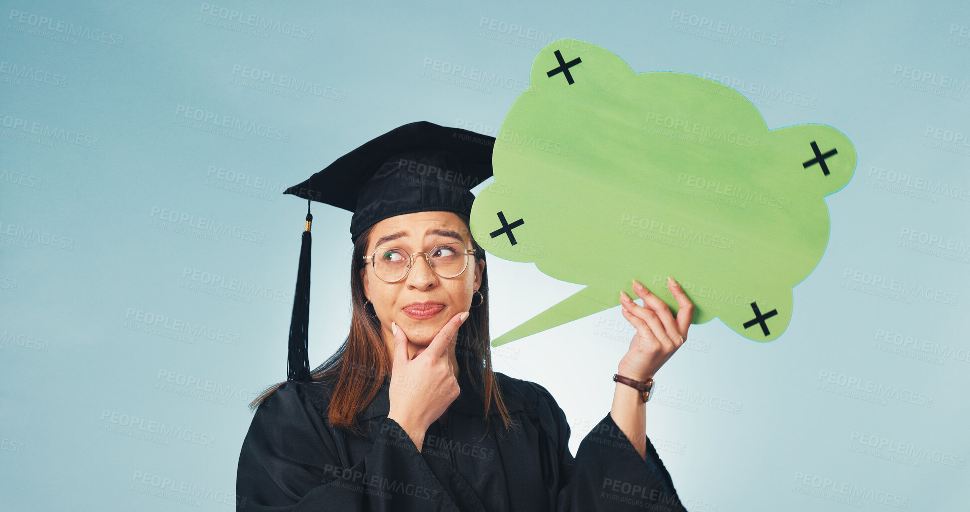 Buy stock photo Graduation, woman and thinking in studio with speech bubble, education forum and opinion. Social media, student or word cloud space on blue background for idea, problem solving or study opportunity