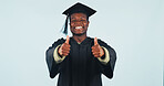 Graduation, portrait or black man with thumbs up in studio for education on a blue background. Male person, student or happy graduate with smile, like emoji or yes for academic success or achievement