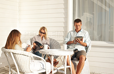 Buy stock photo Relax, child and parents with reading on porch for literacy interest, sun basking and knowledge. Bonding, family and peaceful at home with ebook chapter, magazine and fantasy fiction on weekend hobby