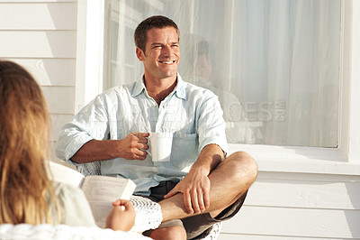 Buy stock photo Thinking, man and coffee on patio with smile, vision and daydreaming for weekend break. Happy, male person and beverage at house with reflection, positive attitude and perspective for stress relief