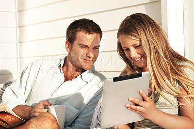 Buy stock photo Happy, father and child at house with tablet, research and browsing website for online games. Smile, man and daughter in home with digital, streaming movies and gaming subscription for weekend break