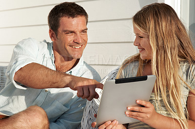 Buy stock photo Smile, father and kid at house with tablet, research and browsing website for online games. Happy, man and daughter in home with digital, streaming movies and gaming subscription for weekend break
