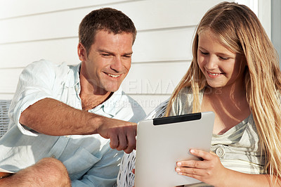 Buy stock photo Smile, father and child at house with tablet, research and browsing website for online games. Happy, man and daughter in home with digital, streaming movies and gaming subscription for weekend break